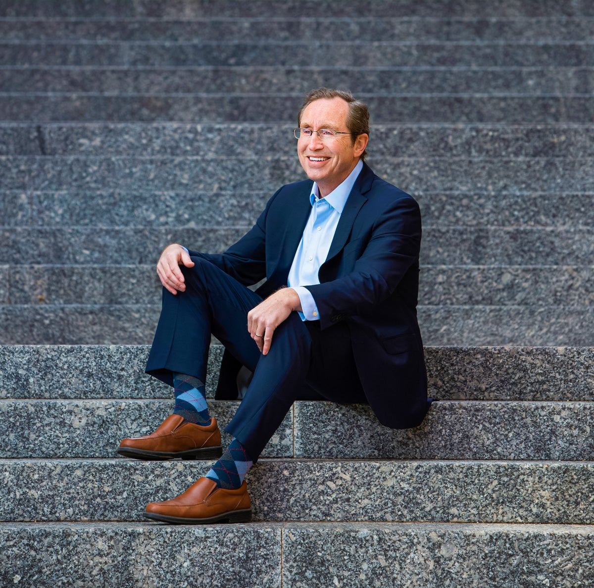 David Whitaker sitting on steps.