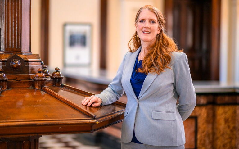 Woman standing inside the Custom House