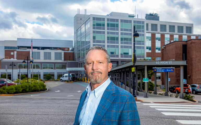 Steven Michaud in front of a hospital