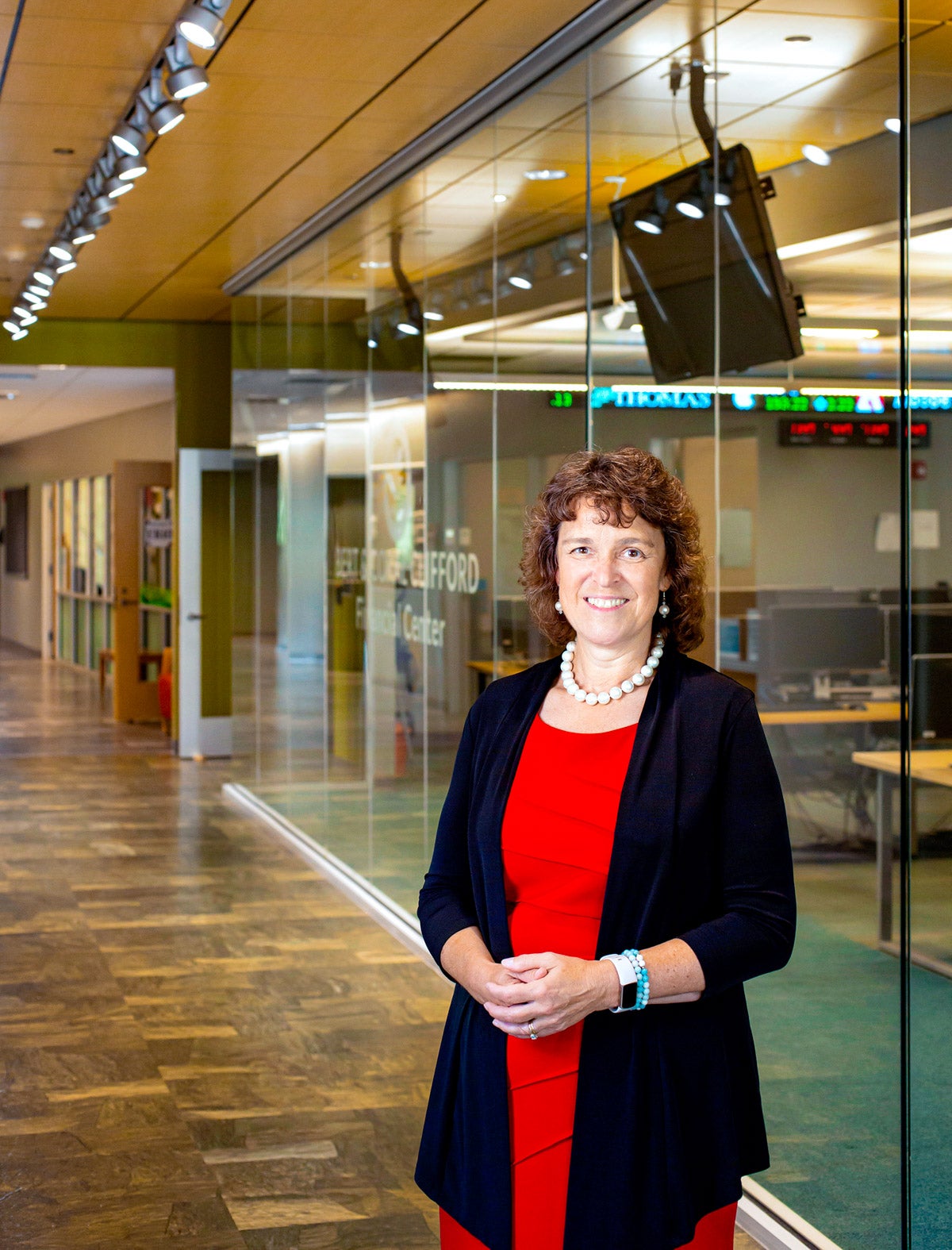 Laurie Lachance standing in Thomas College building