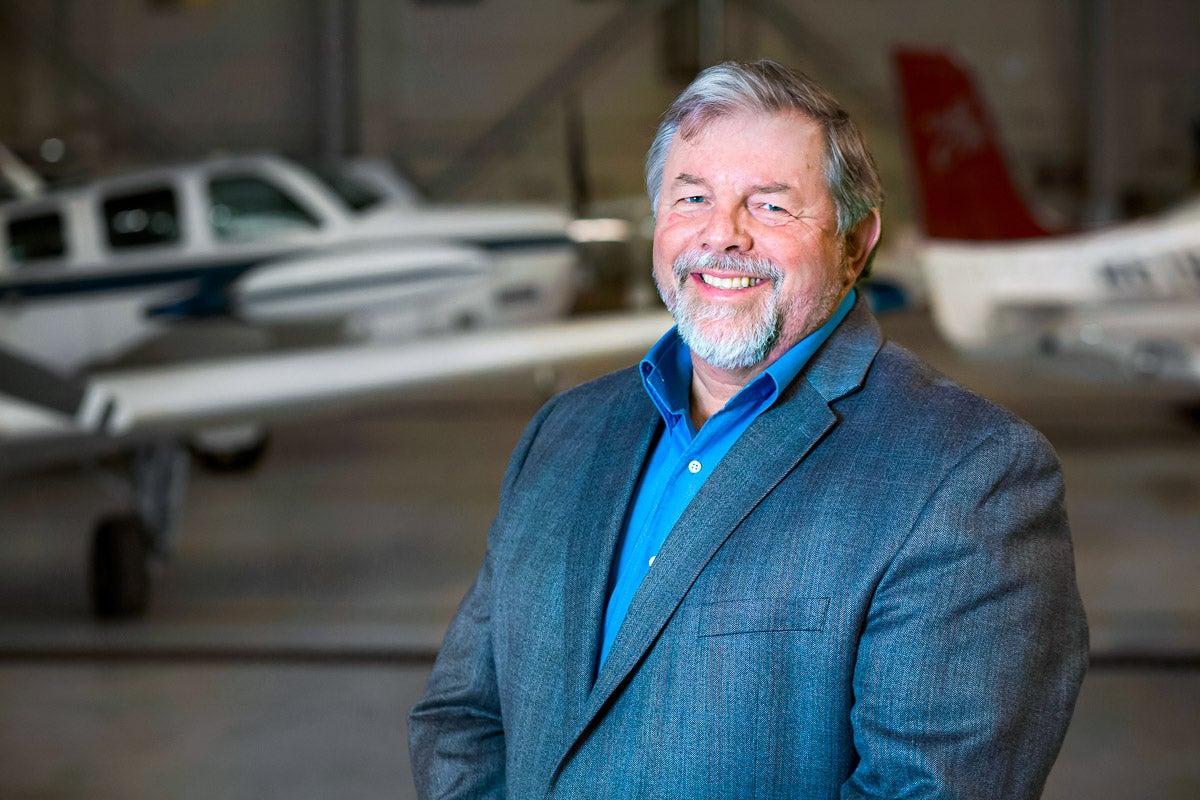 Steve Levesque with planes in the background.
