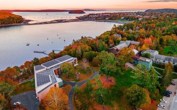 aerial of building woods water