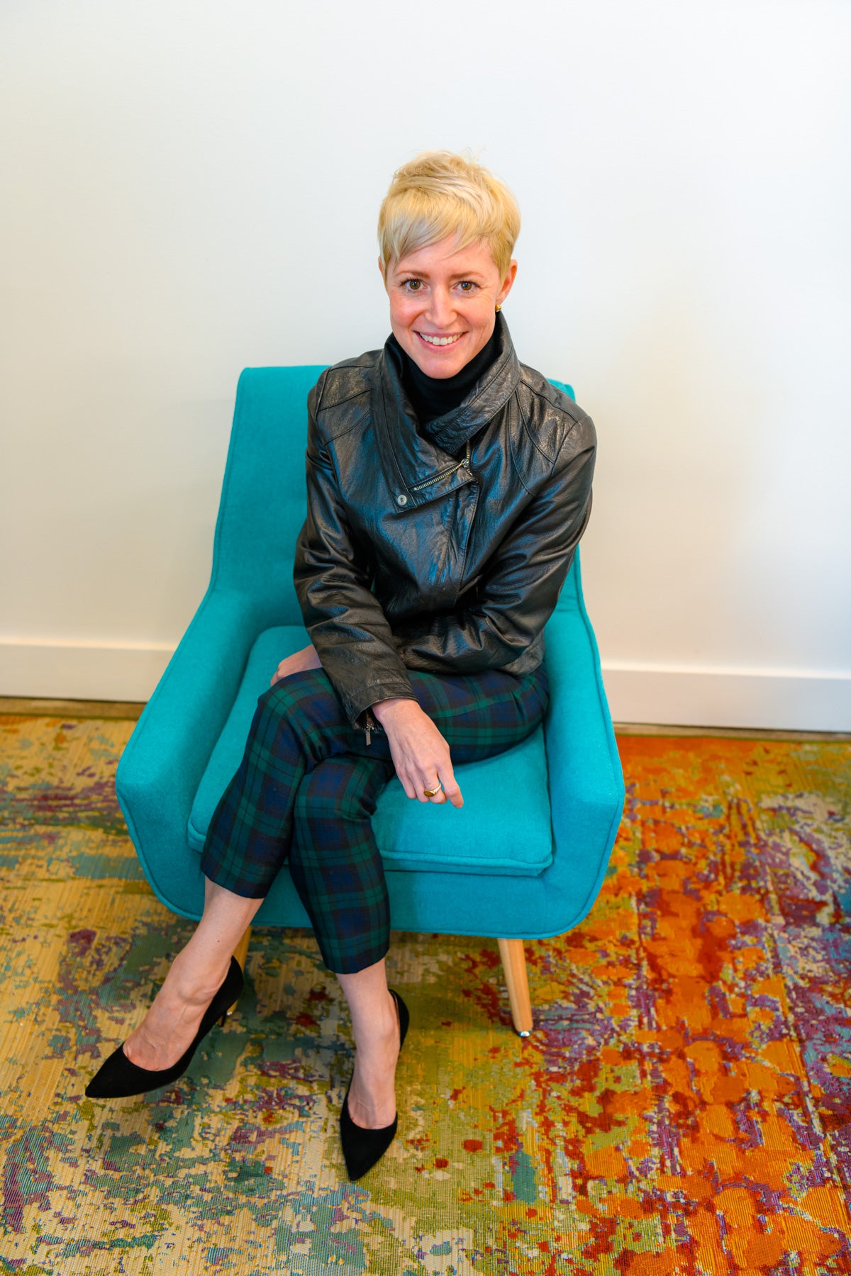 Torey Penrod-Cambra seated on a chair