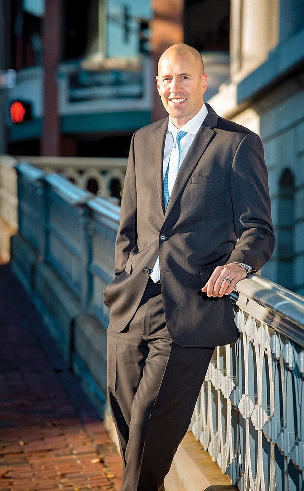 Portrait of man standing outdoors in a suit
