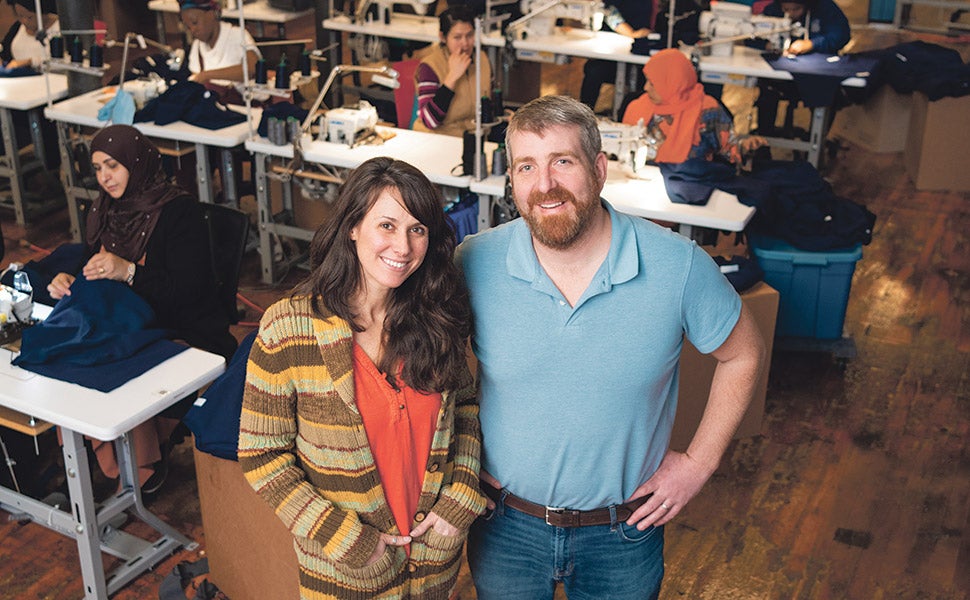 Ben Waxman and Whitney Reynolds at American Roots in Westbrook, with the factory in the background