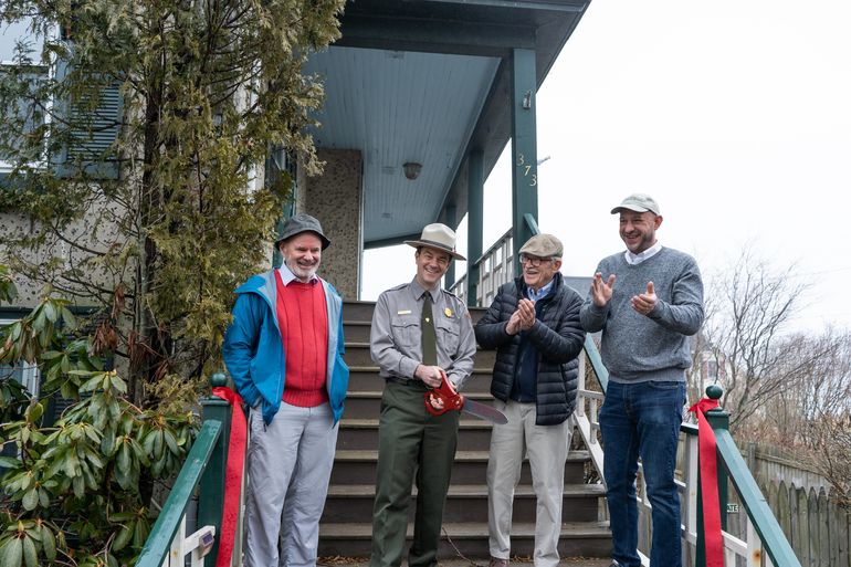 4 people standing on stairs