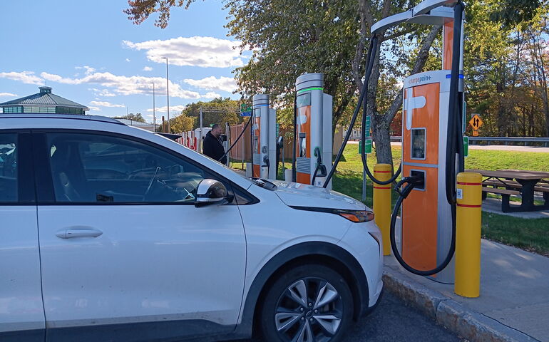 car parked at EV charge station