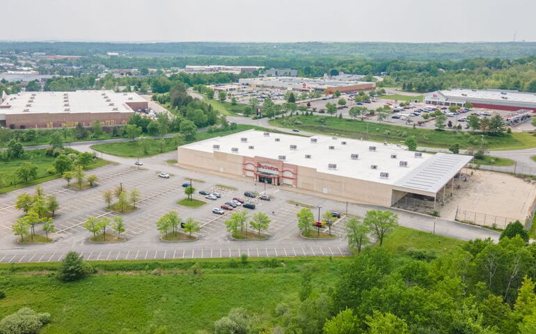 An aerial view shows big low-lying buildings.