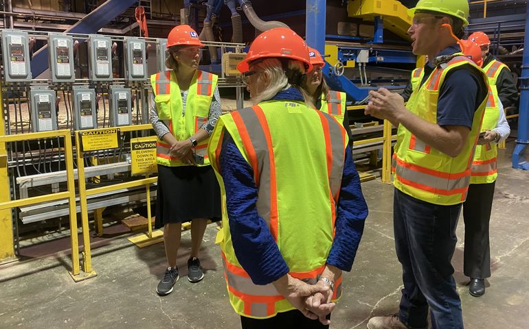 people with yellow vests at mill