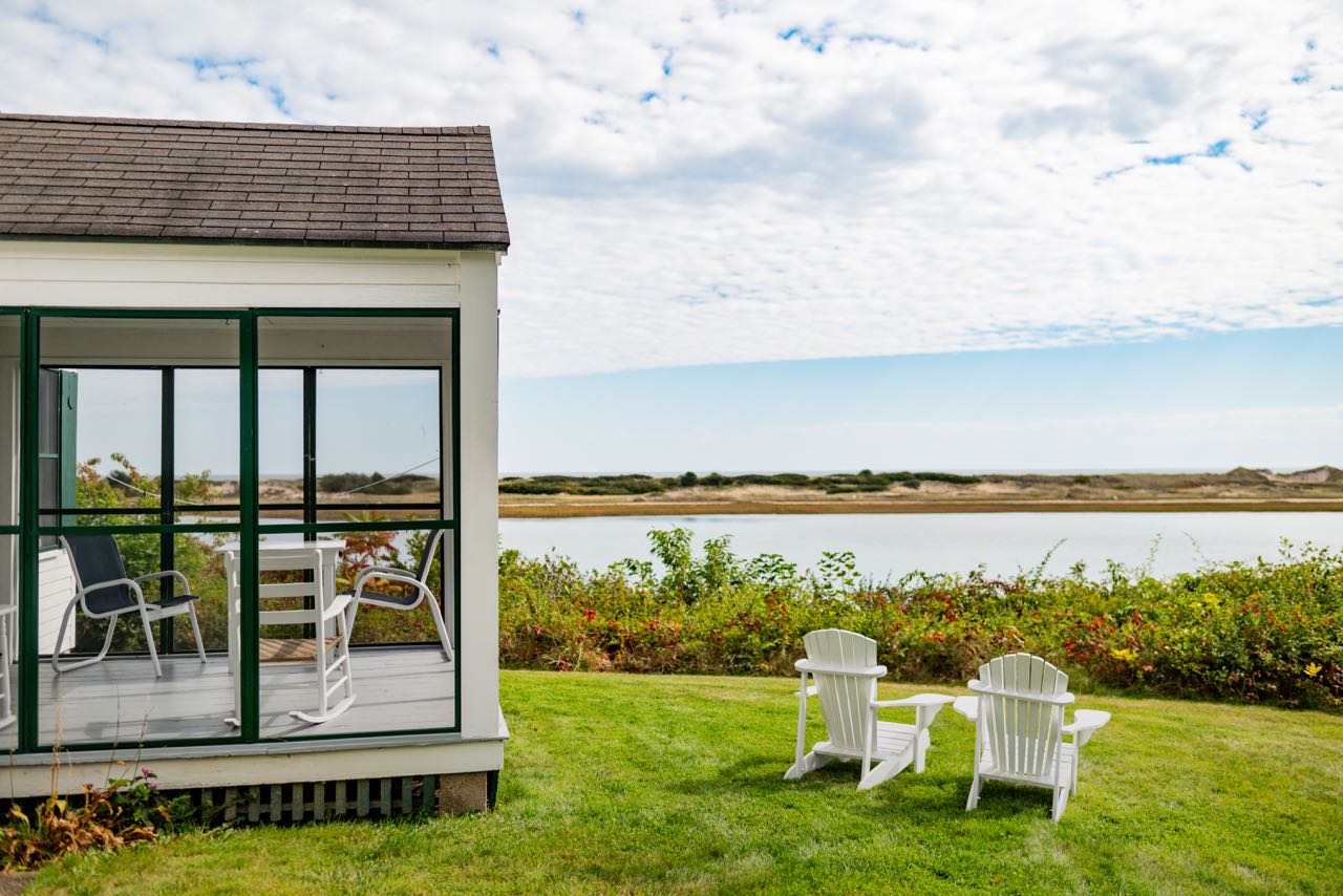 screened porch and deck chairs facing ocean