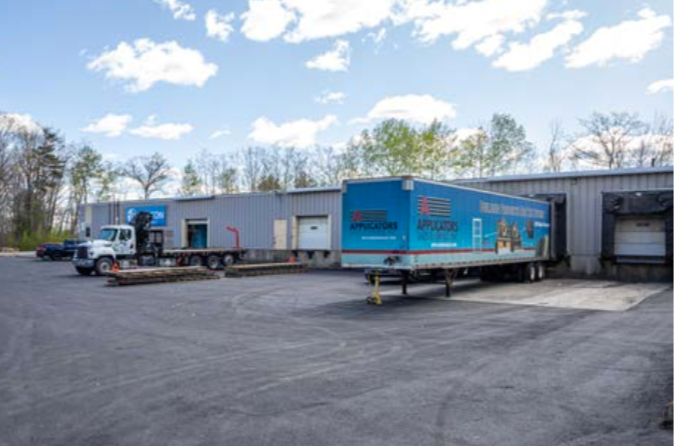 building with big doors and shipping container