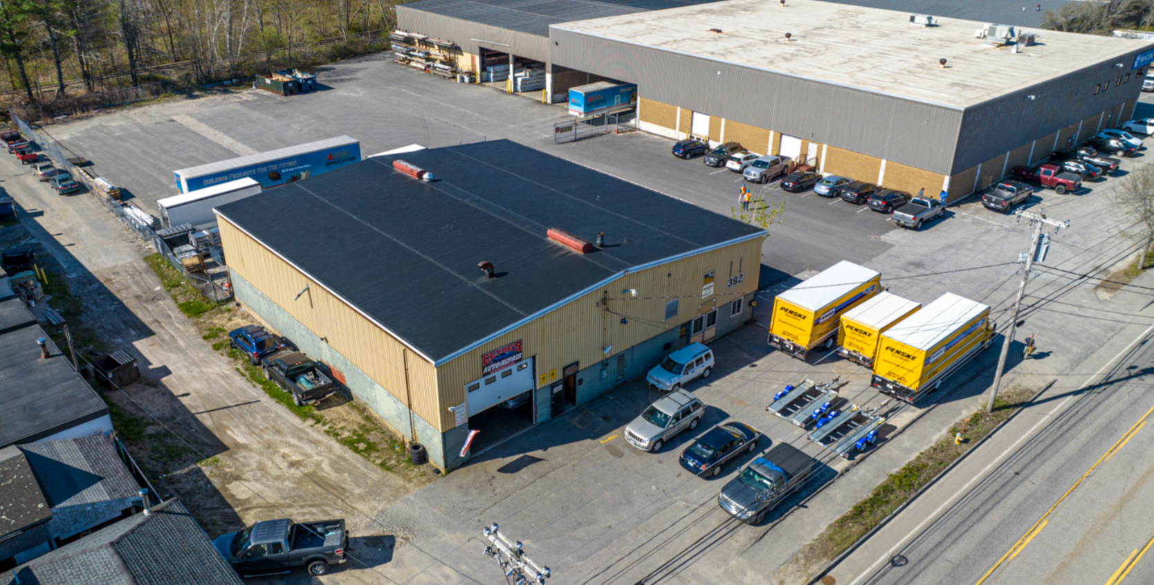 aerial of big buildings, pavement and vehicles