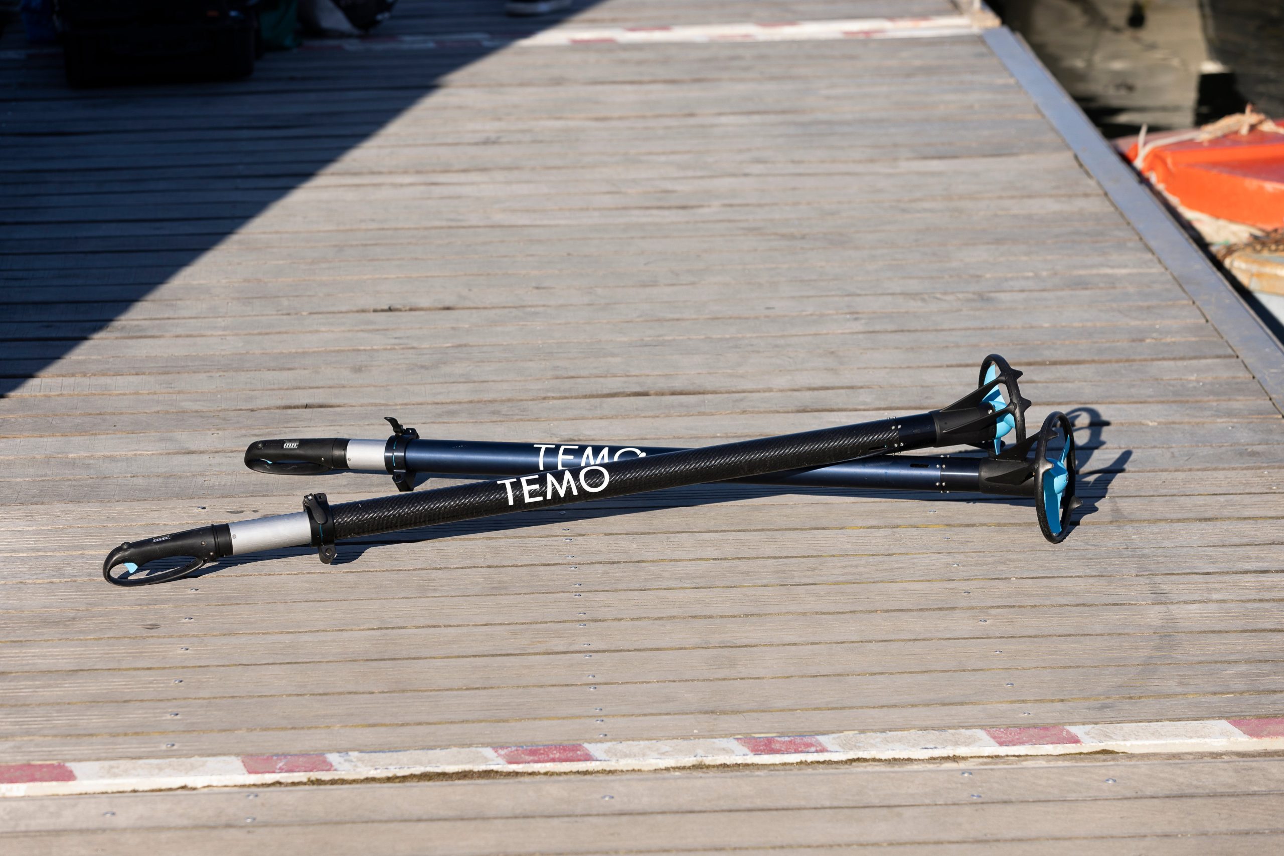 Two motors lie on a dock.