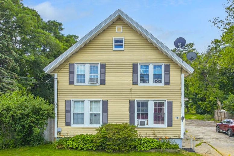 yellow house with shutters