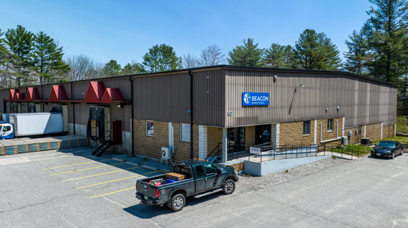 building withe vehicles and sign