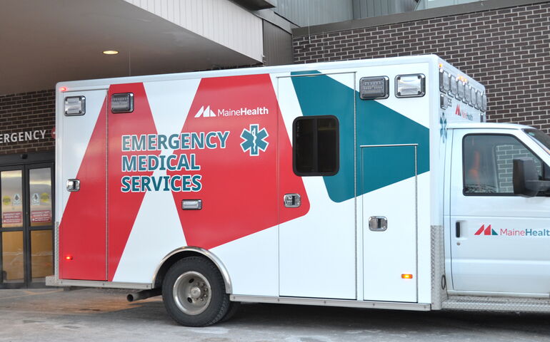 Exterior of a truck outside an entryway.