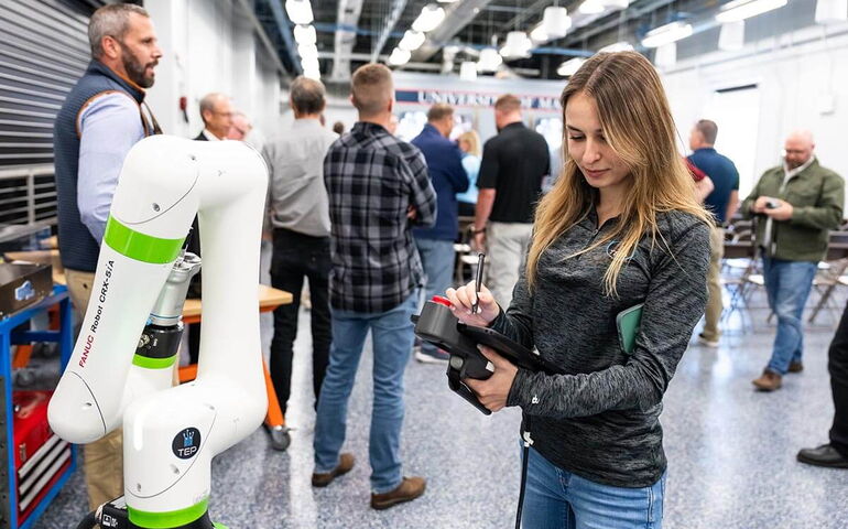 A machine is in a room full of people.