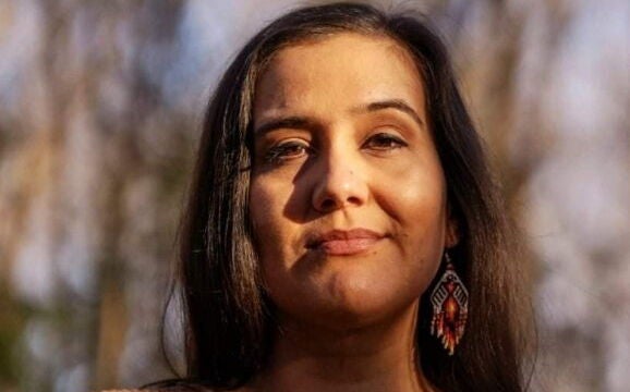 Maulian Bryant is seen in a posed headshot.