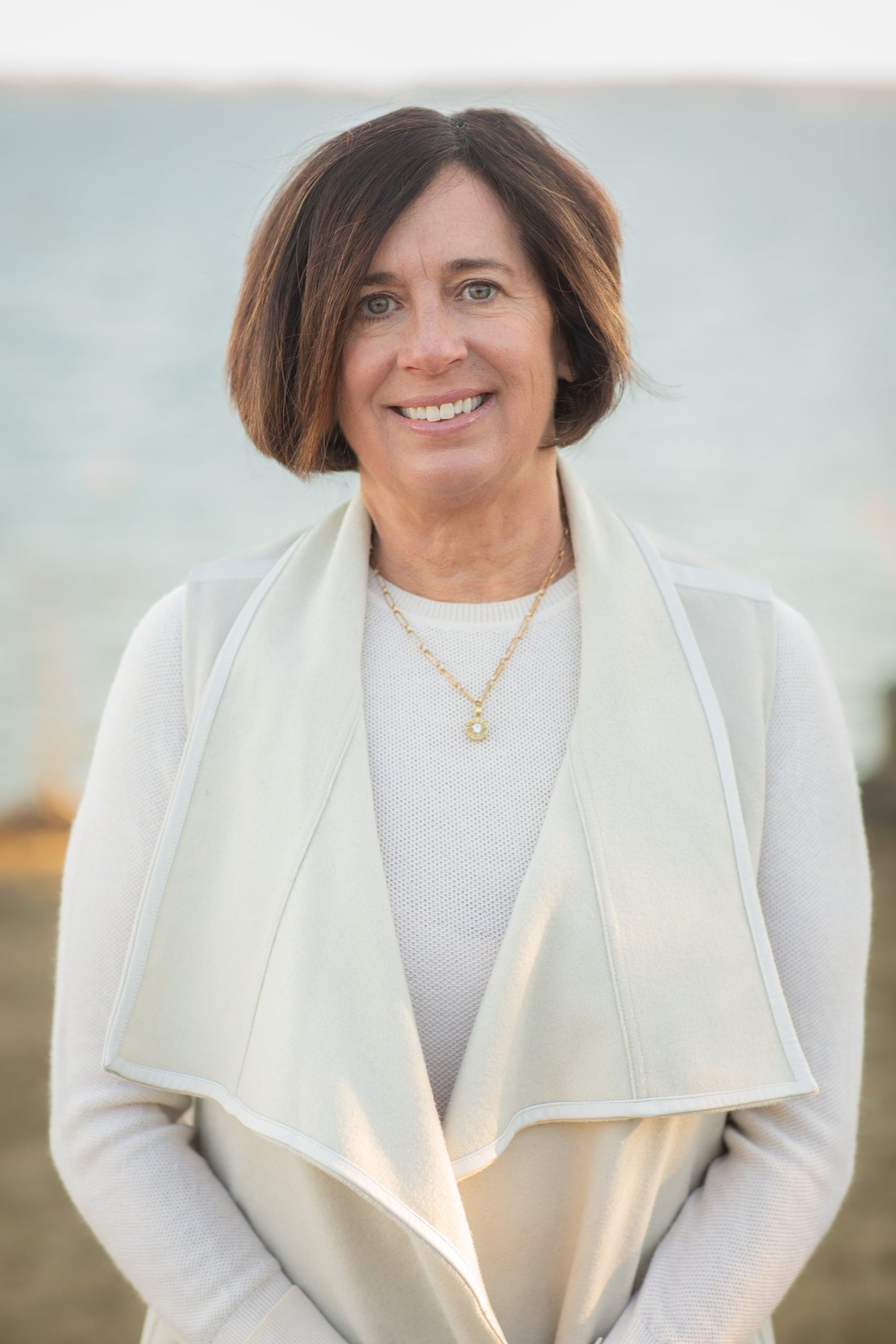 person in white sweater coat