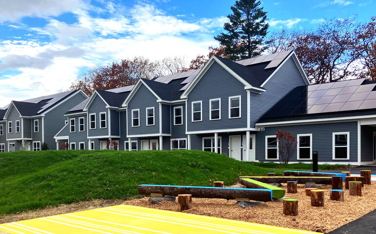 A gray building and lawn