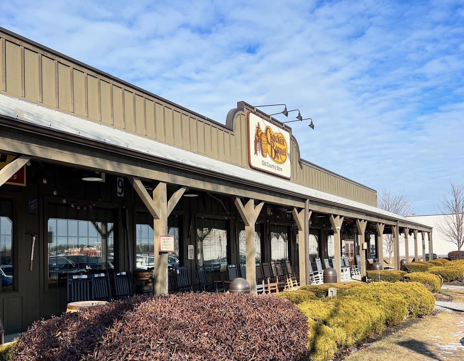 An exterior view of a long, low building.