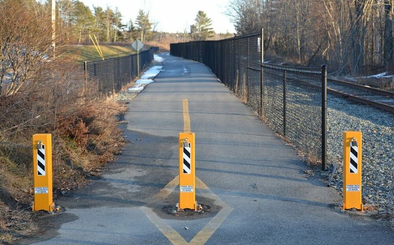 paved path with barrier posts