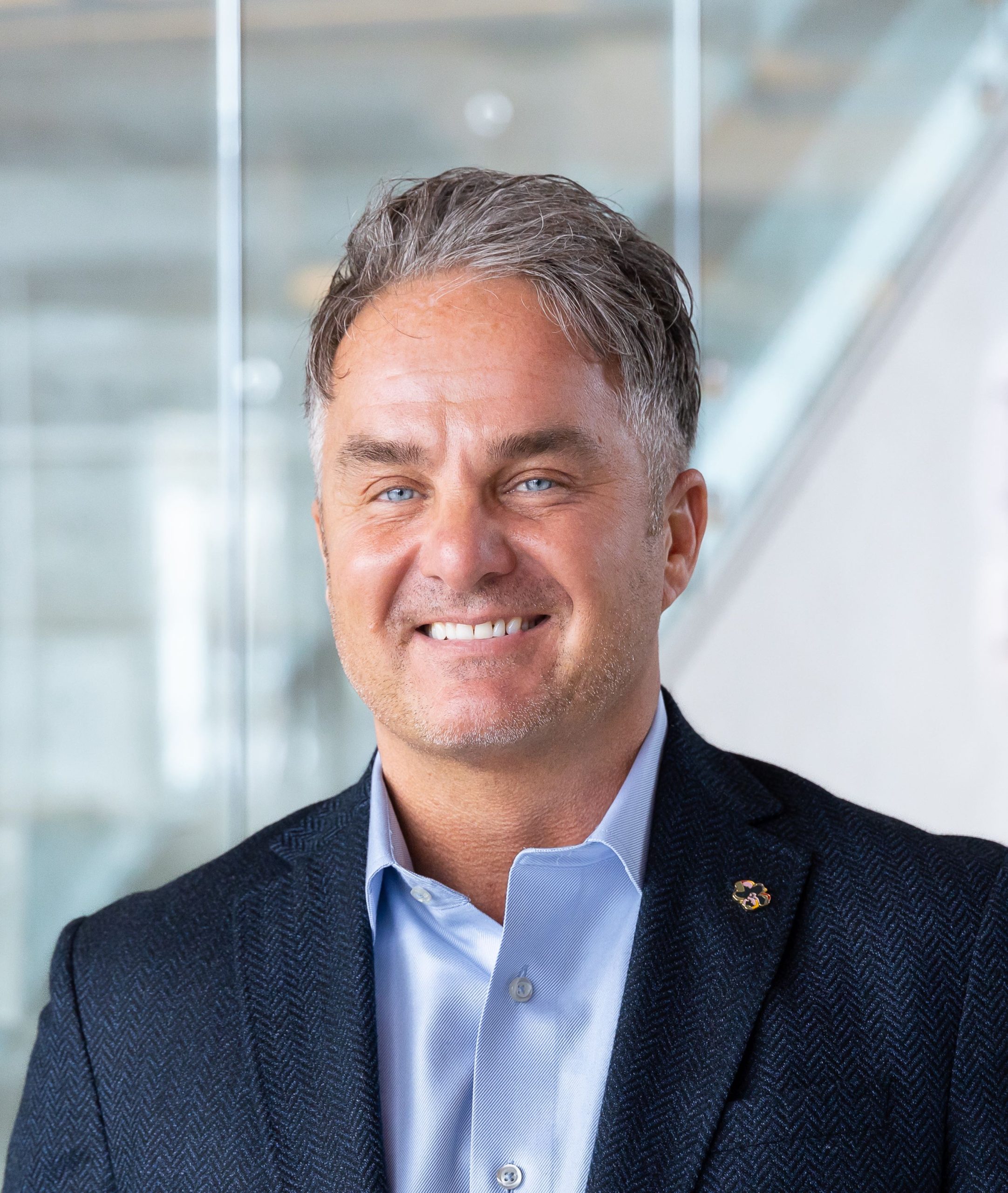 person in blue tweed blazer