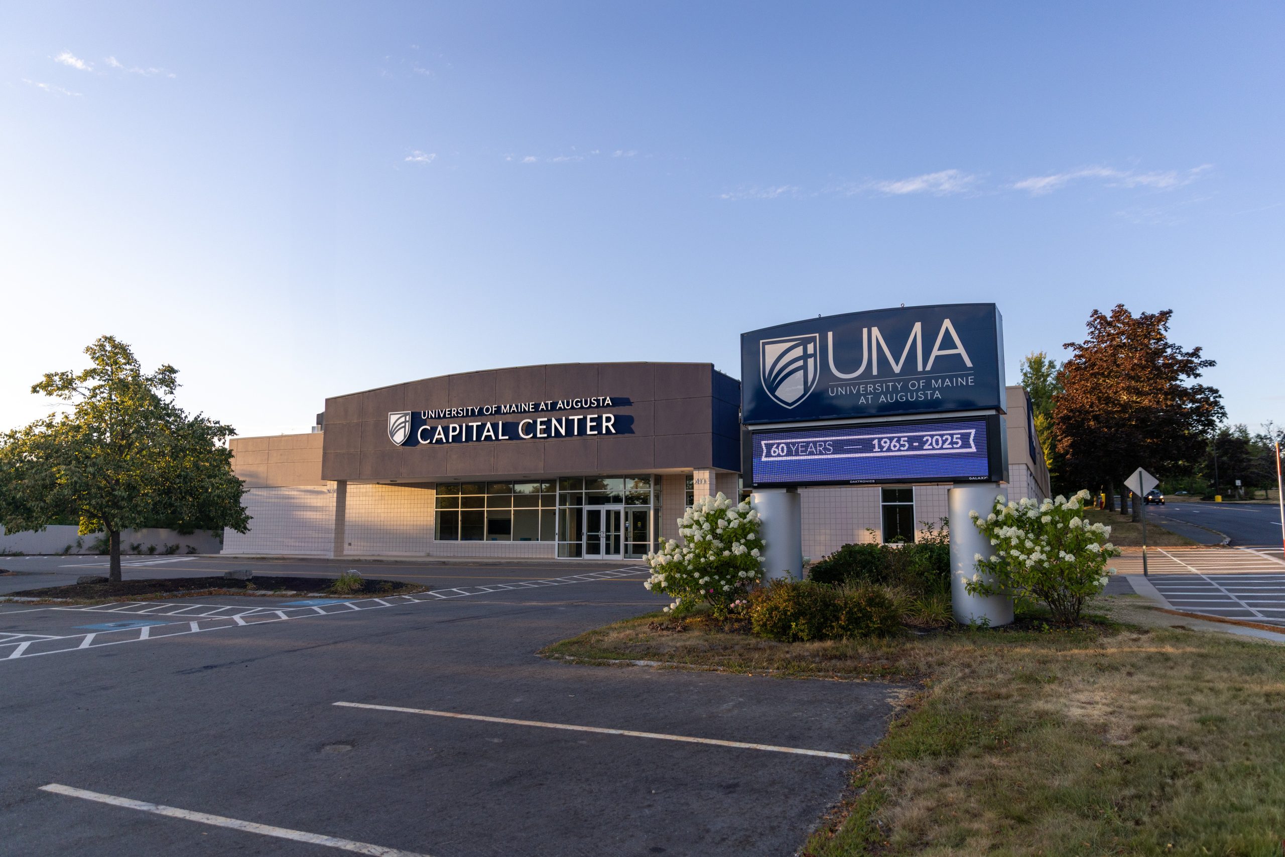 An exteerior view shows a building and a sign.