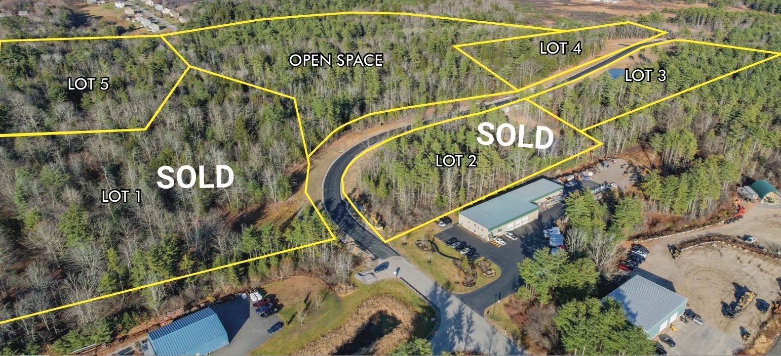 An aerial view shows woods and roads overlaid with outlines and words.