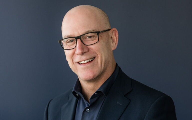 A person poses for a headshot