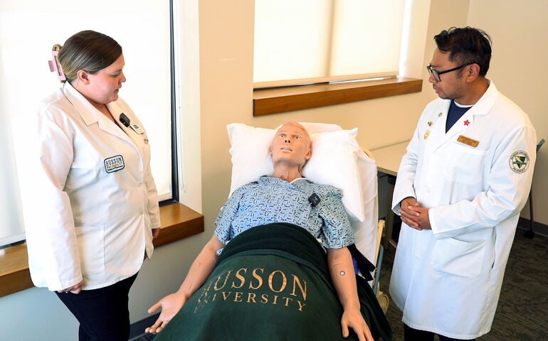 2 people with mannikin