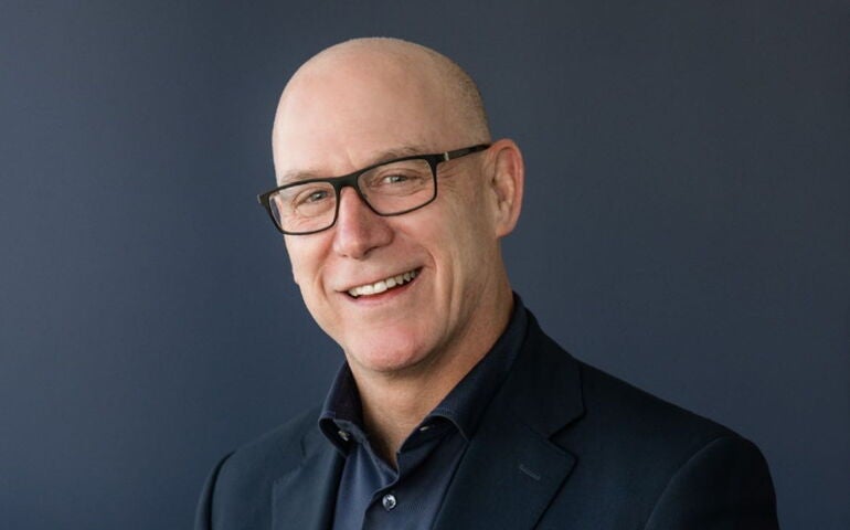 A person poses for a headshot.