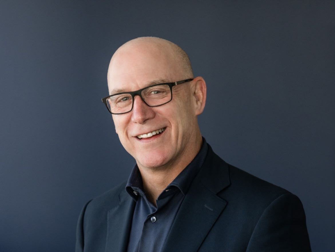 A person poses for a headshot.