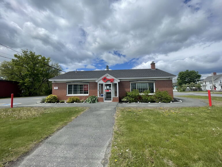 small bank building and lawn and path