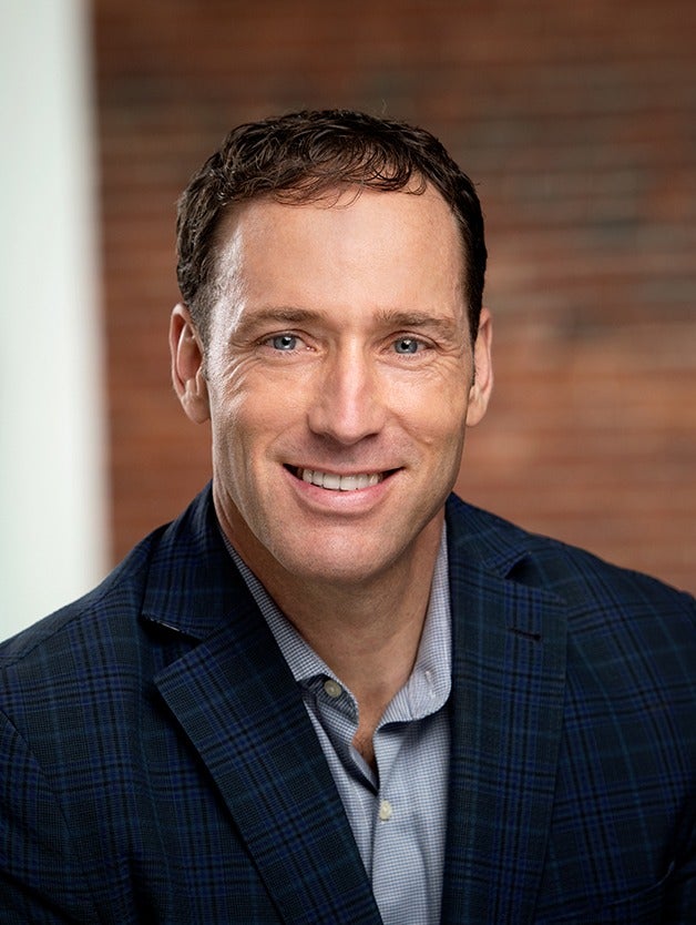 person in button-down shirt and blazer