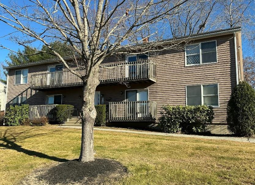 An exterior view of a brown-sided building.