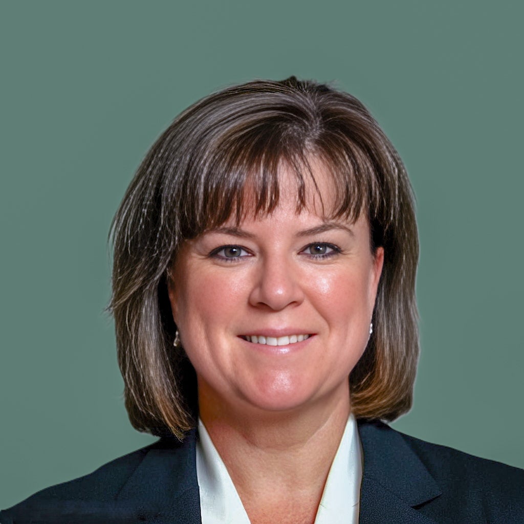 A person poses for a headshot.