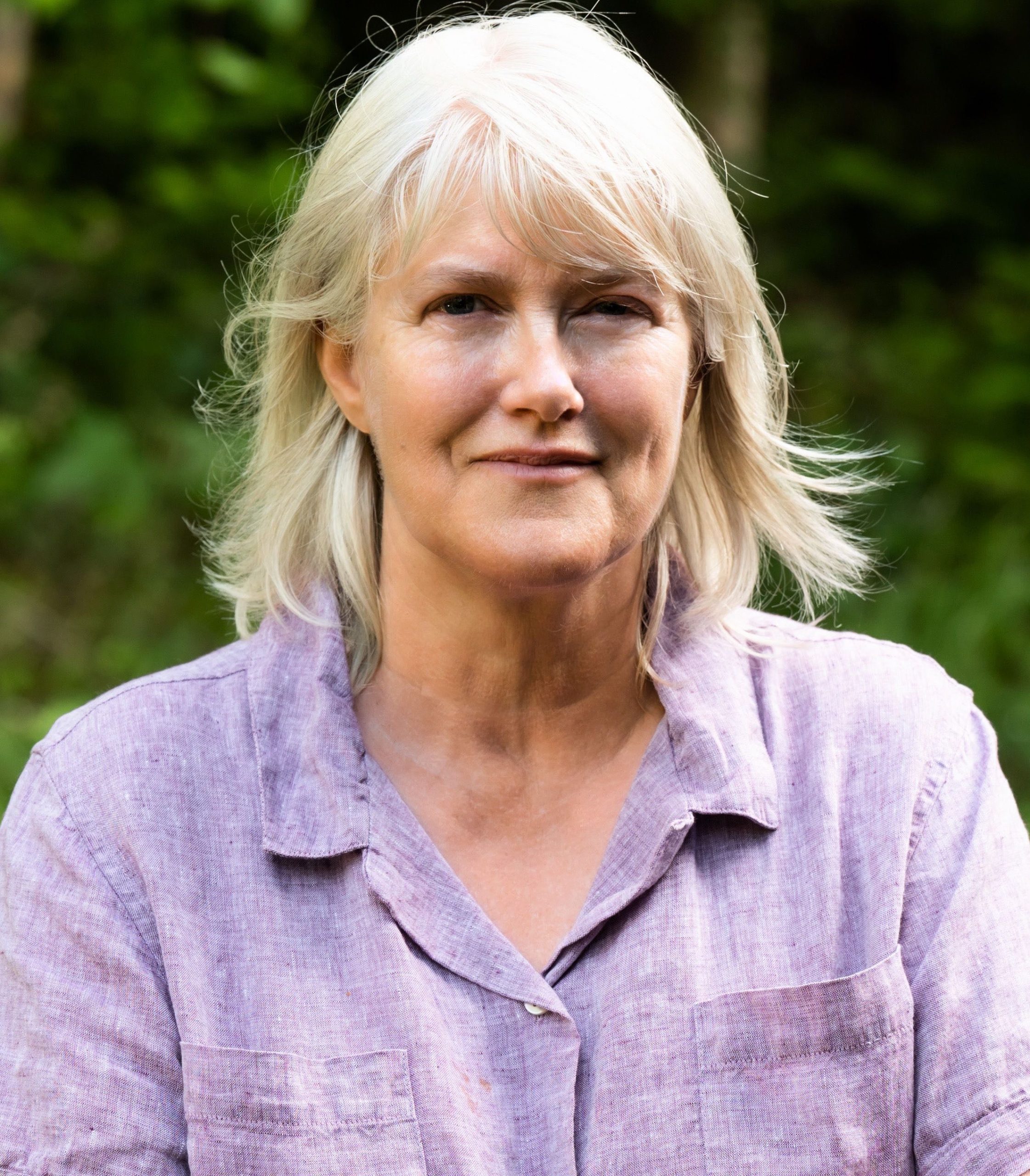 A person poses for a headshot.