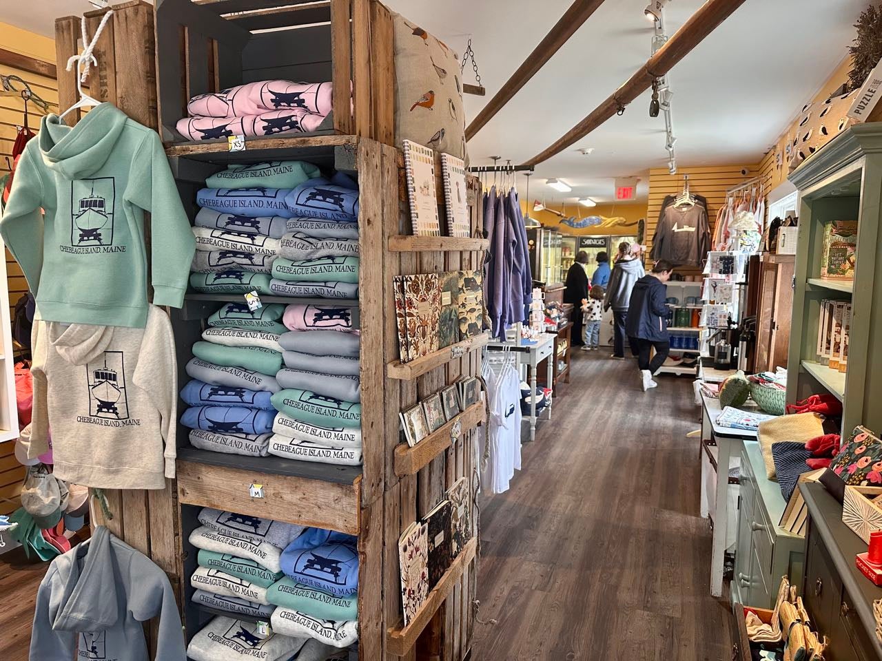 a room has shelves and clothes.