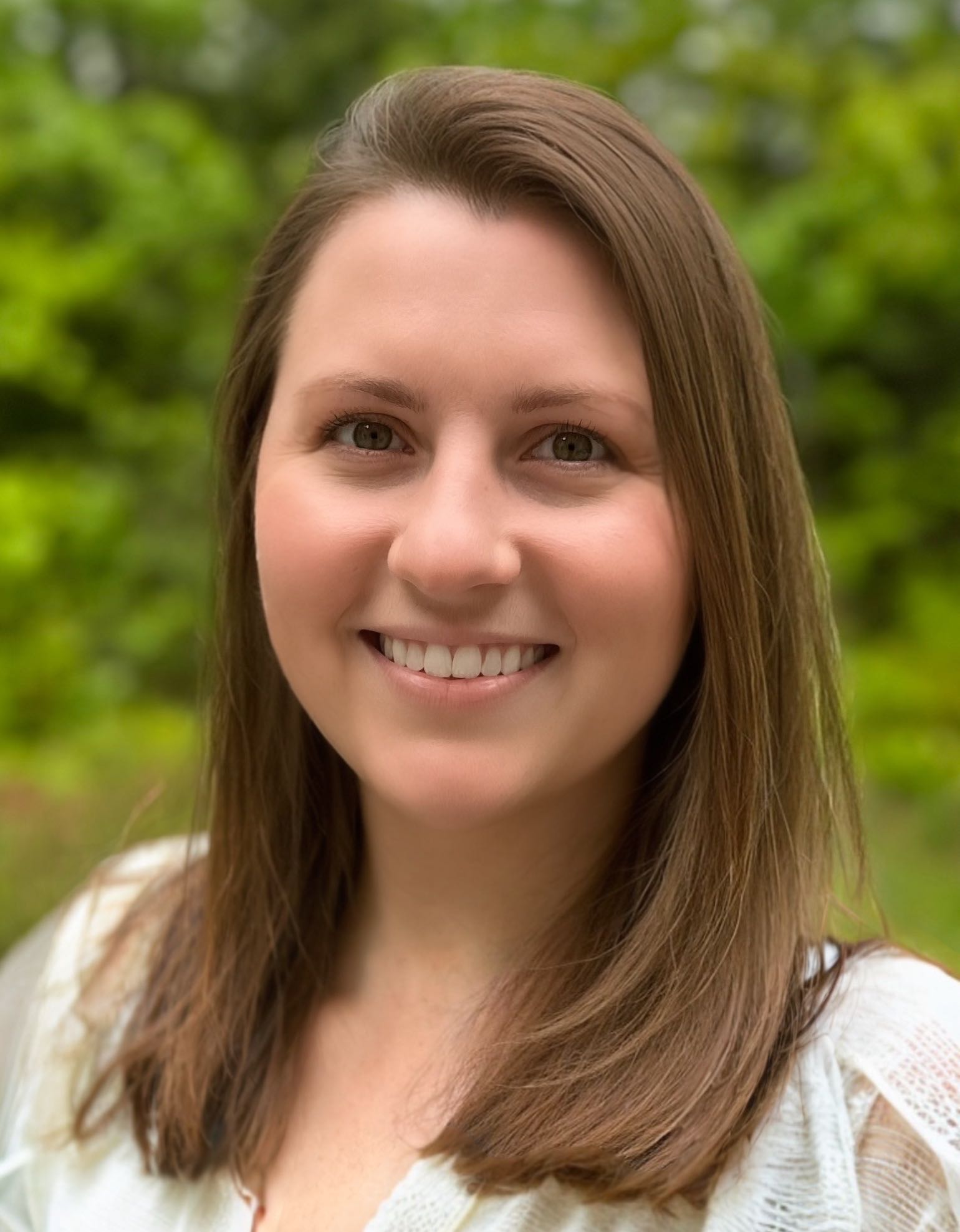 A person poses for a headshot.