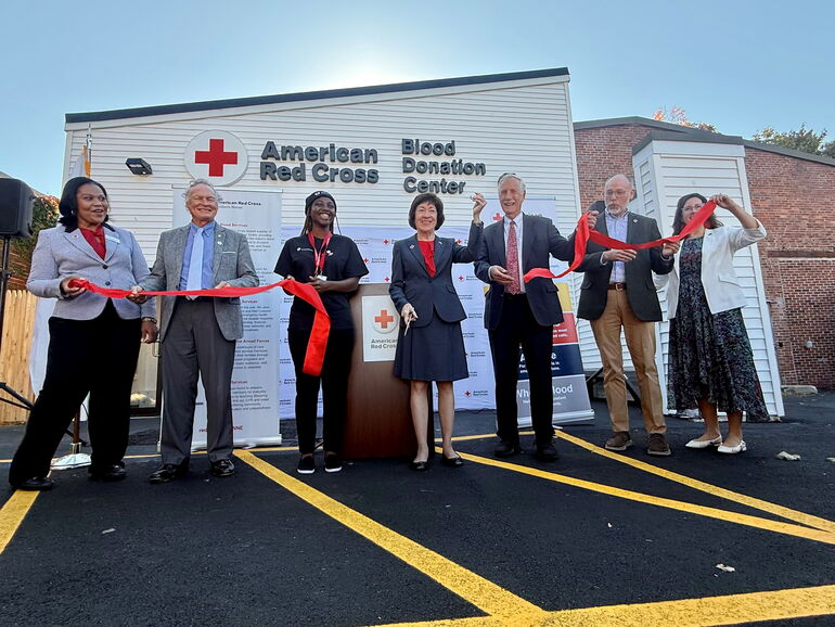 people at a ribbon cutting