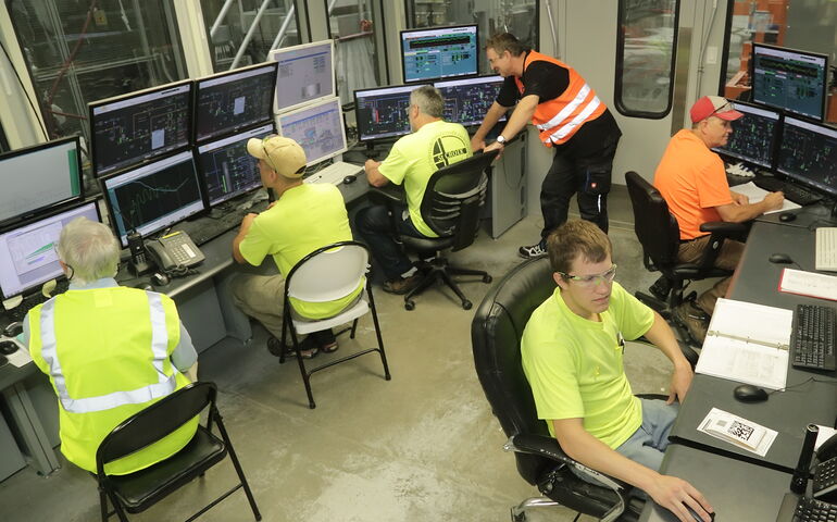 People work at desks at St. Croix Tissue.