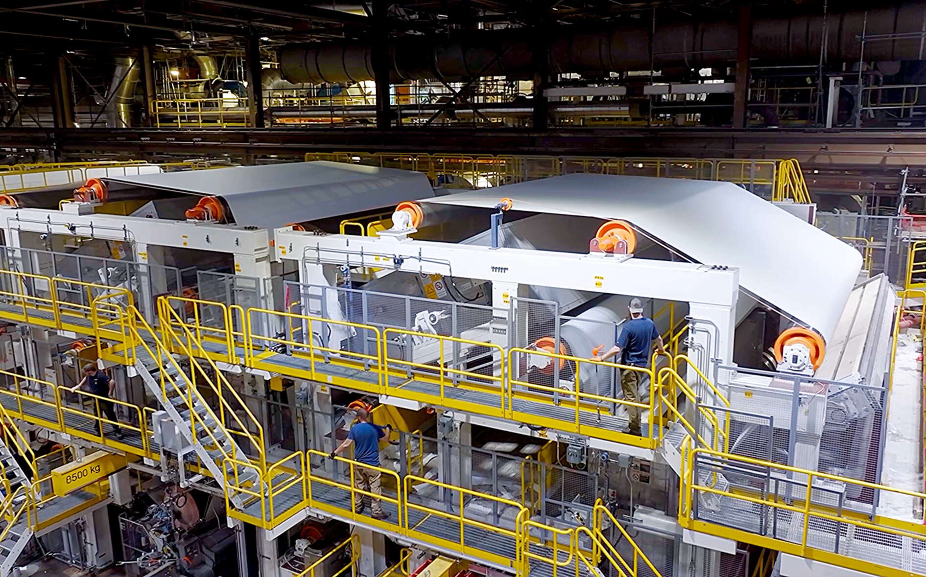 A big room is filled with lots of machinery.