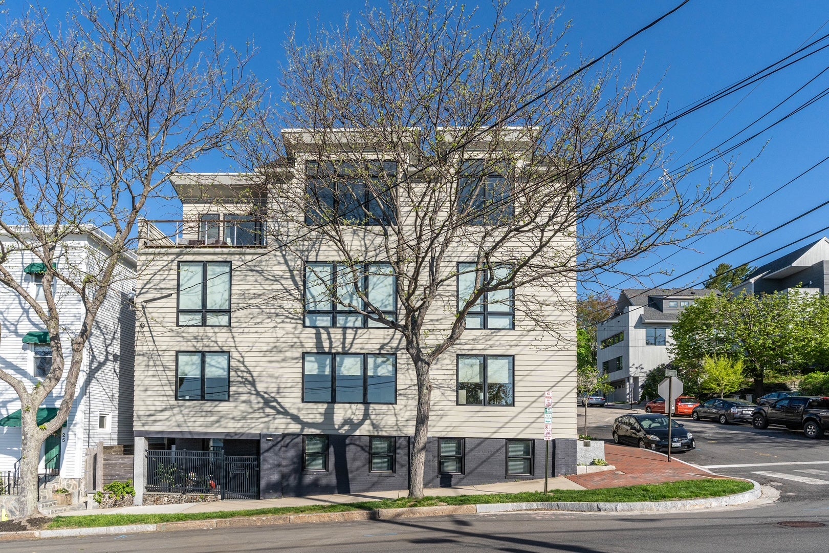 Exerior of a building with a tree.