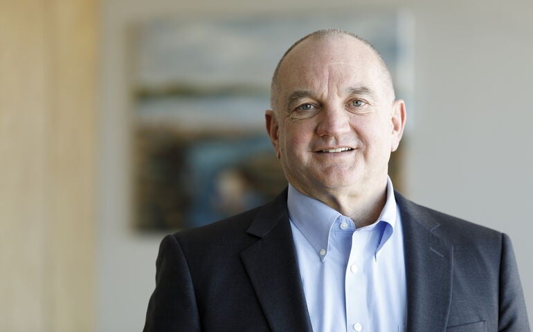 A person poses for a headshot.