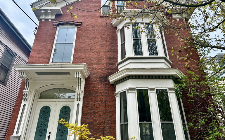 A brick building with white trim.