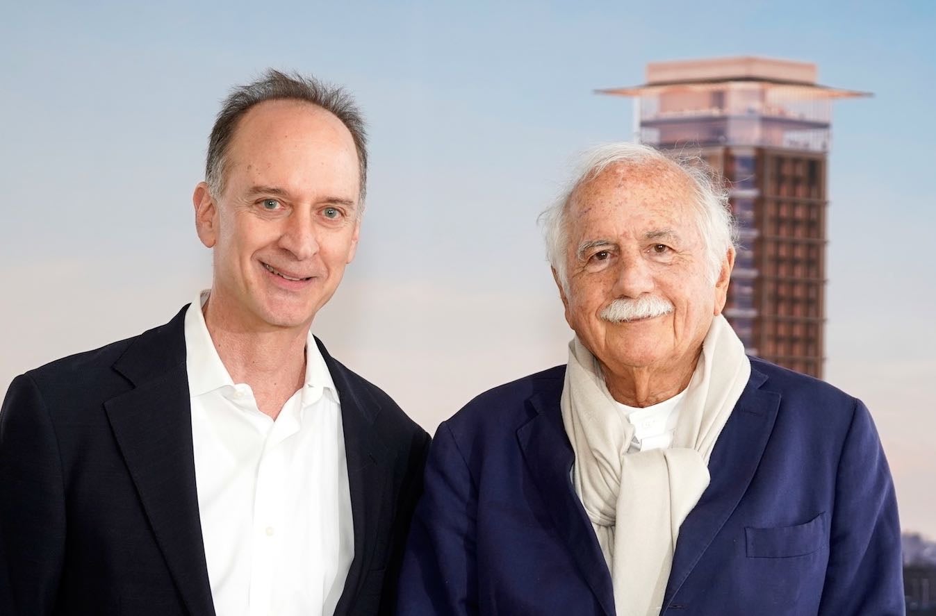 Two people pose for a photo