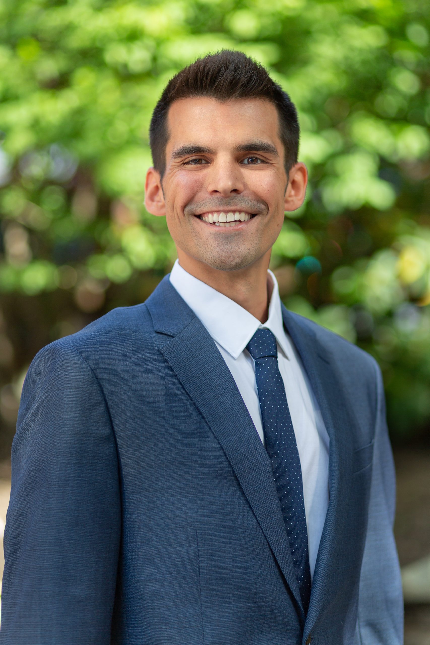 smiling person in blue suit