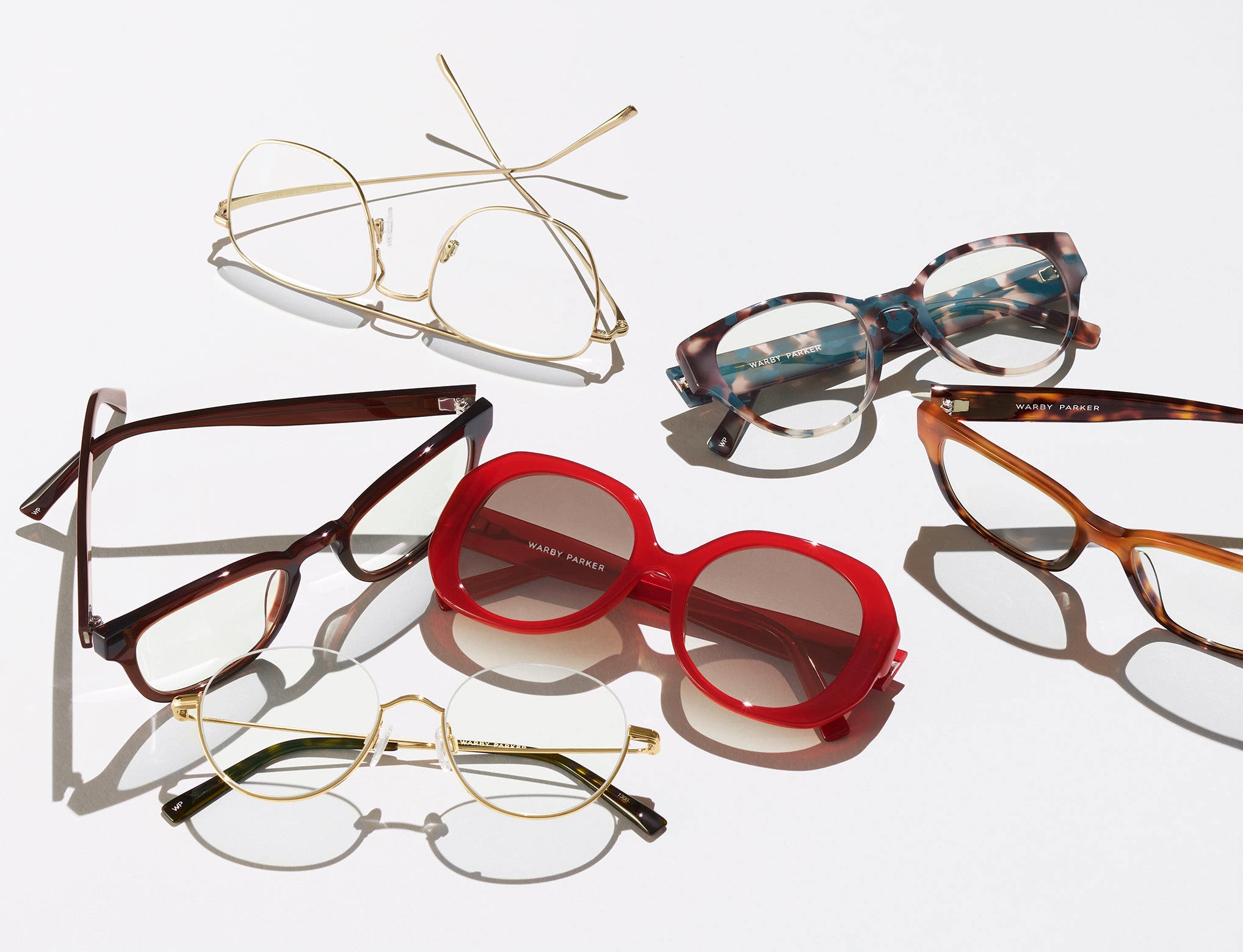 Glasses are scattered on a surface.