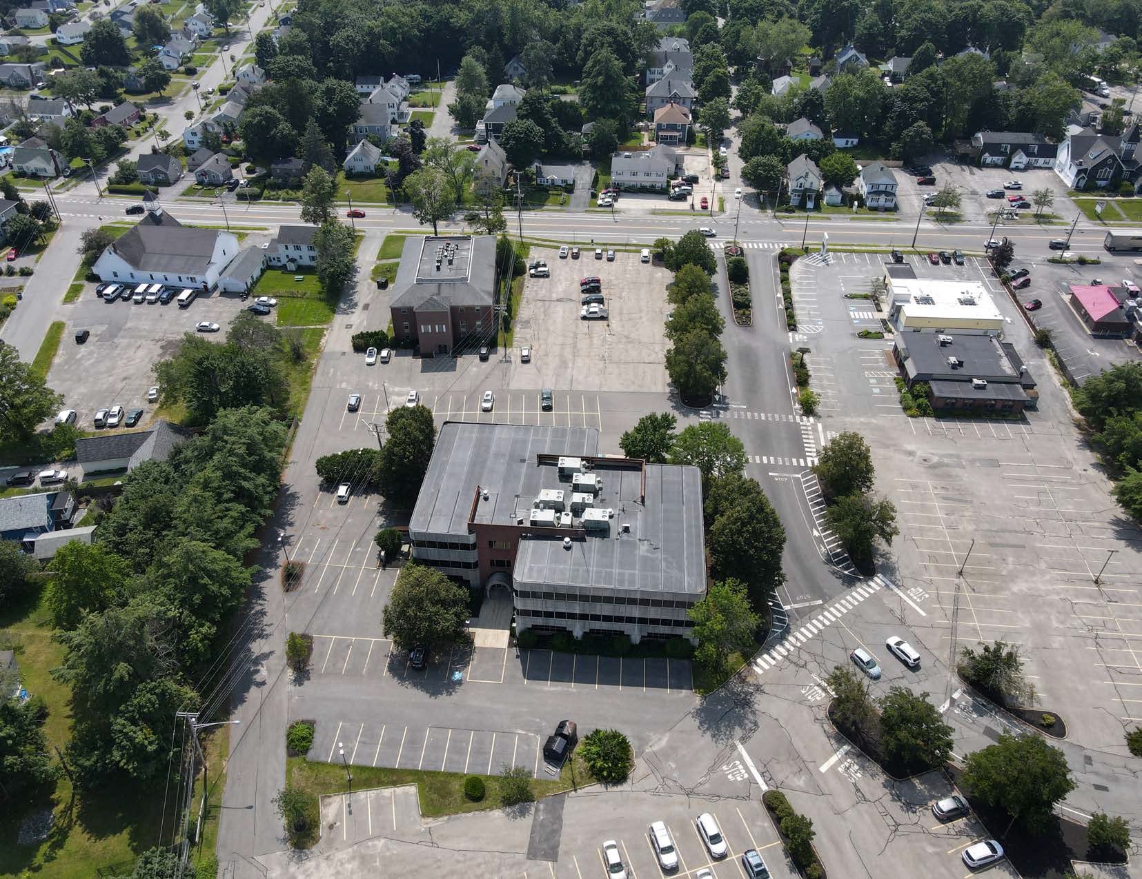 aerial of buildings and parking lots